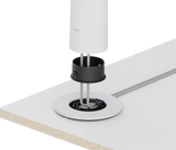 An exploded image of the Logitech Sight in white being secured to a table with the table mount.